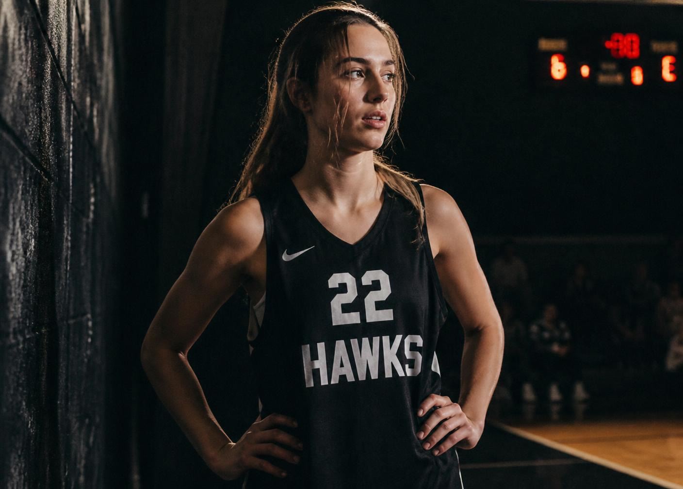 A young woman athlete pausing before training